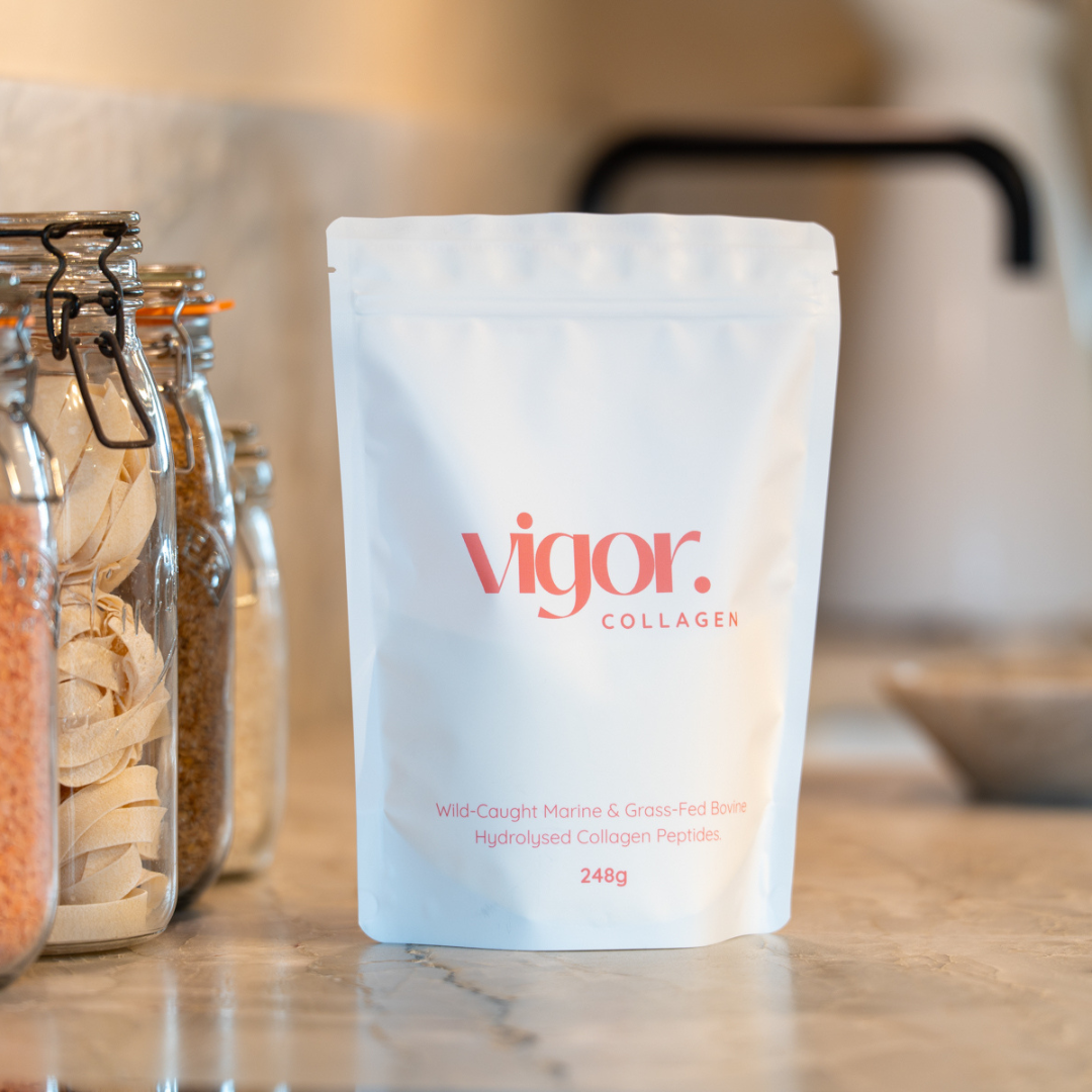 Package of 'vigor' collagen on a kitchen counter with jars in the background