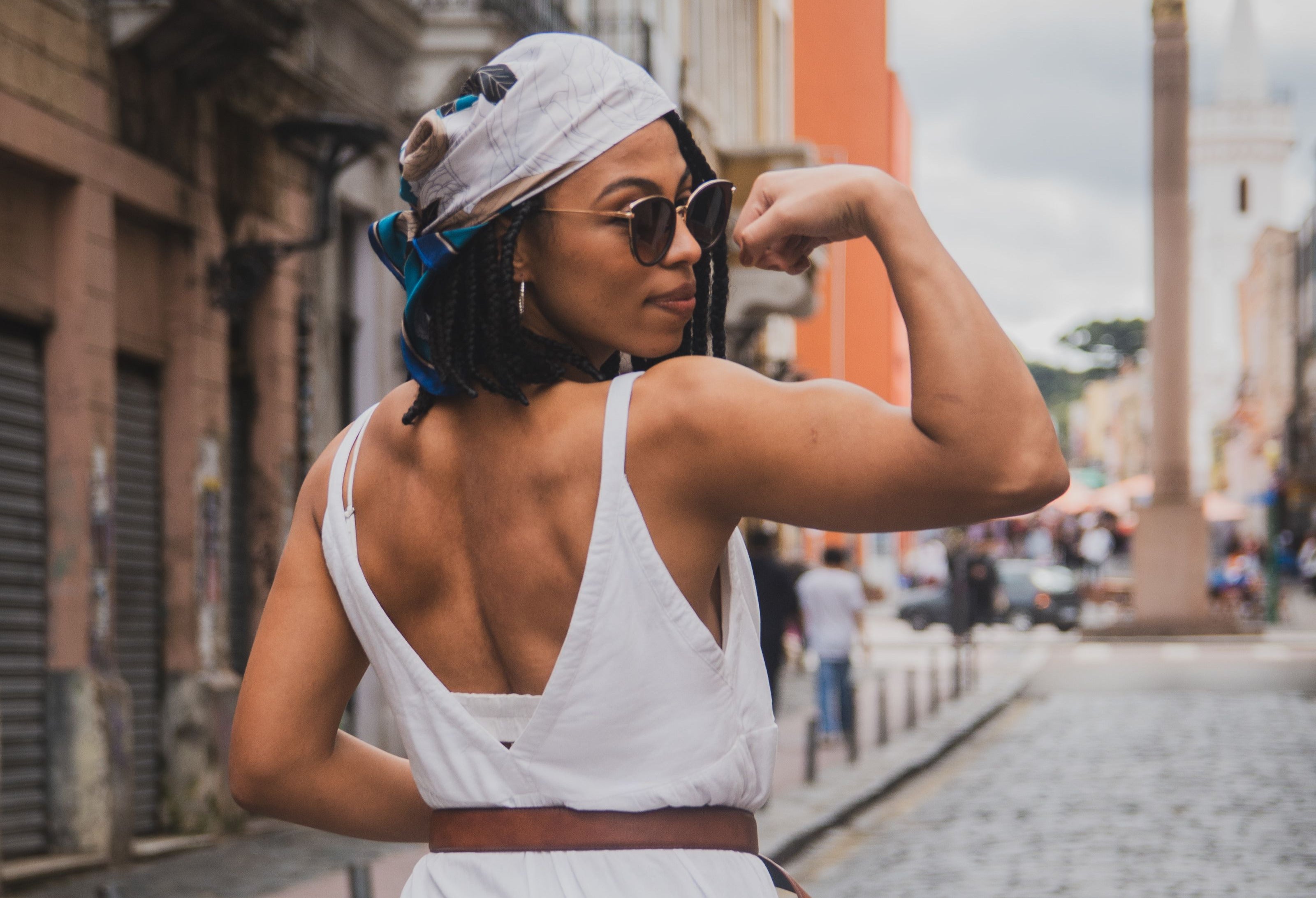 Woman flexing bicep - benefits of Vigor Creatine, muscle strength, exercise recovery